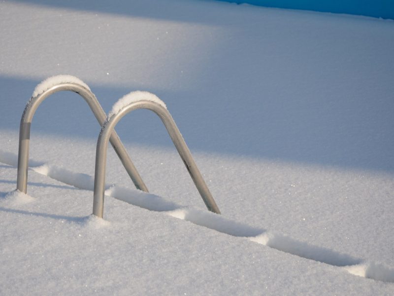 Image of swimming pool covered in snow